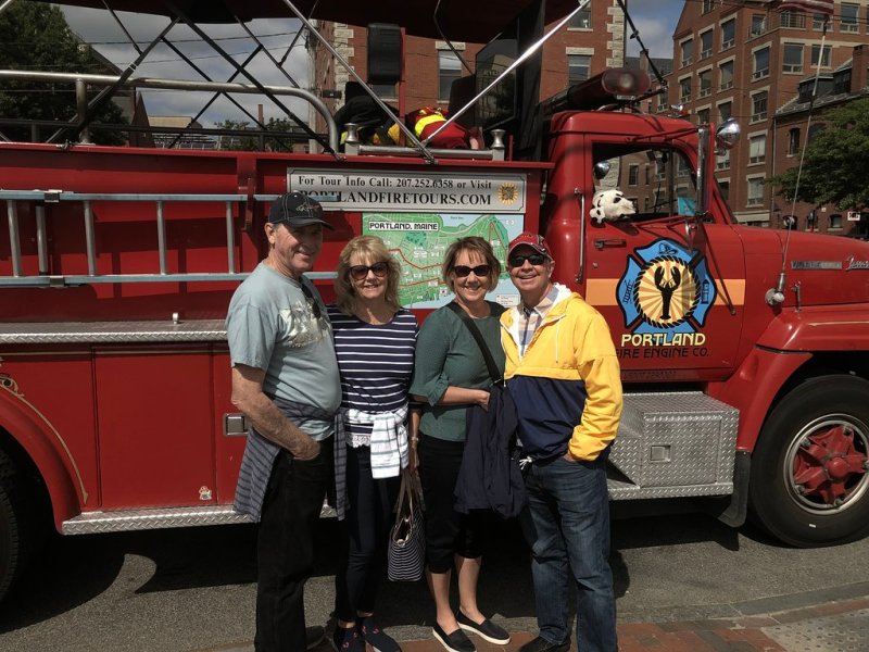 Guests posing in Front of Fire Truck Narrated Sightseeing Tour, Portland Maine